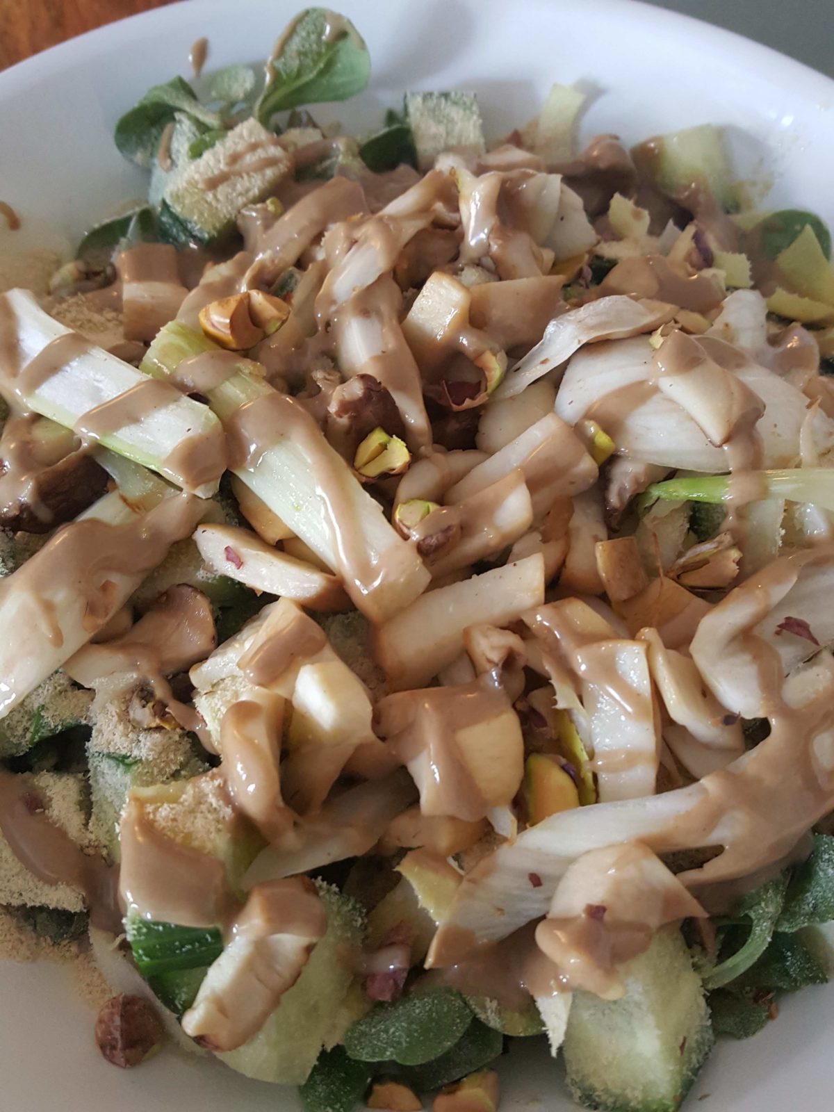 Lamb’s lettuce bowl with fresh tahini